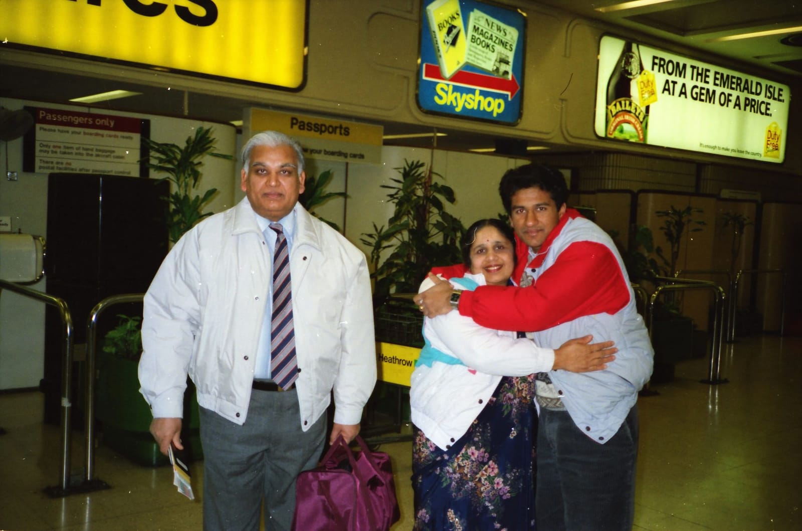 Sunil with his father and mother at Heathrow Airport, 1990s
